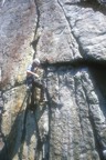 Colin reaches for gear after the difficult traverse