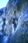 Laybacking and stemming up the side of the hueco allows one to reach a high jug
