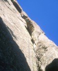 Disappearing into the off-width; this is actually climbed on the outside, but it's hard to make the transition