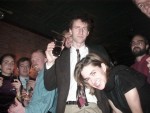 Simon pouring beer over Kristen's head